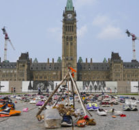 A memorial on Parliament Hill continues to be displayed in Ottawa on Monday, July 19, 2021. Sean Kilpatrick/The Canadian Press.