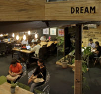 Young Indian entrepreneurs and freelancers work inside Innov8, a lax co-working space in New Delhi, India. Altaf Qadri/AP Photo.