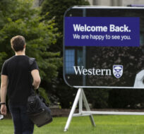 A student walks towards the Western University campus in London, Ont., on September 15, 2021. Nicole Osborne/The Canadian Press.