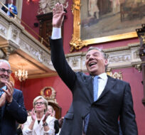 Quebec Premier Francois Legault waves to guests as he and his Coalition Avenir Quebec government is sworn in, Tuesday, October 18, 2022 during a ceremony at the legislature in Quebec City. Jacques Boissinot/The Canadian Press. 