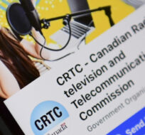 A person navigates to the online social-media pages of the Canadian Radio-television and Telecommunications Commission. Sean Kilpatrick/The Canadian Press.