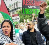 People take part in a protest for Palestine in Montreal, Sunday, October 8, 2023. Graham Hughes/The Canadian Press. 