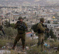 Israeli soldiers are seen during a military operation in the Balata refugee camp, West Bank, Sunday, Nov. 19, 2023. Majdi Mohammed/AP Photo. 