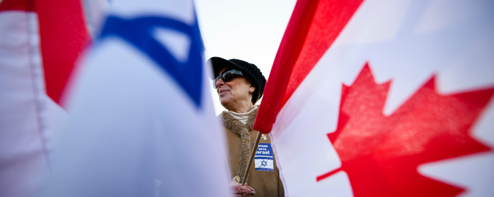 People gather following a demonstration in support of Israel and the release of hostages, in Toronto, Sunday, Nov. 12, 2023. Christopher Katsarov/The Canadian Press. 