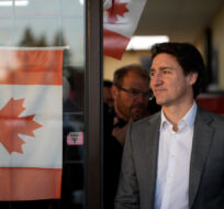 Prime Minister Justin Trudeau leaves a small business after stopping to meet the people inside, in Surrey, B.C., on Tuesday, November 14, 2023. Darryl Dyck/The Canadian Press. 
