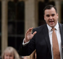 Industry Minister James Moore answers a question during Question Period in the House of Commons in Ottawa on Wednesday, Jan. 28, 2015. Sean Kilpatrick/The Canadian Press. 