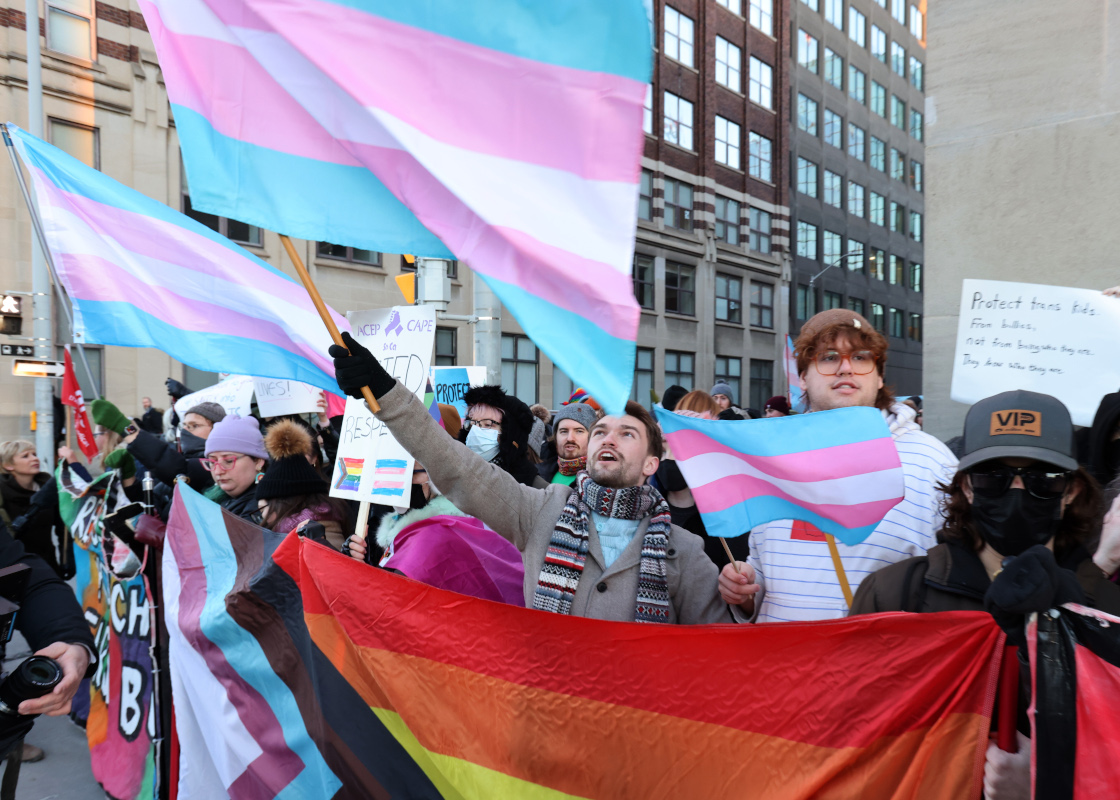 People protest Alberta Premier Danielle Smith's proposed youth transgender policies as she appears at an event in Ottawa on Monday, Feb. 5, 2024. Patrick Doyle/The Canadian Press